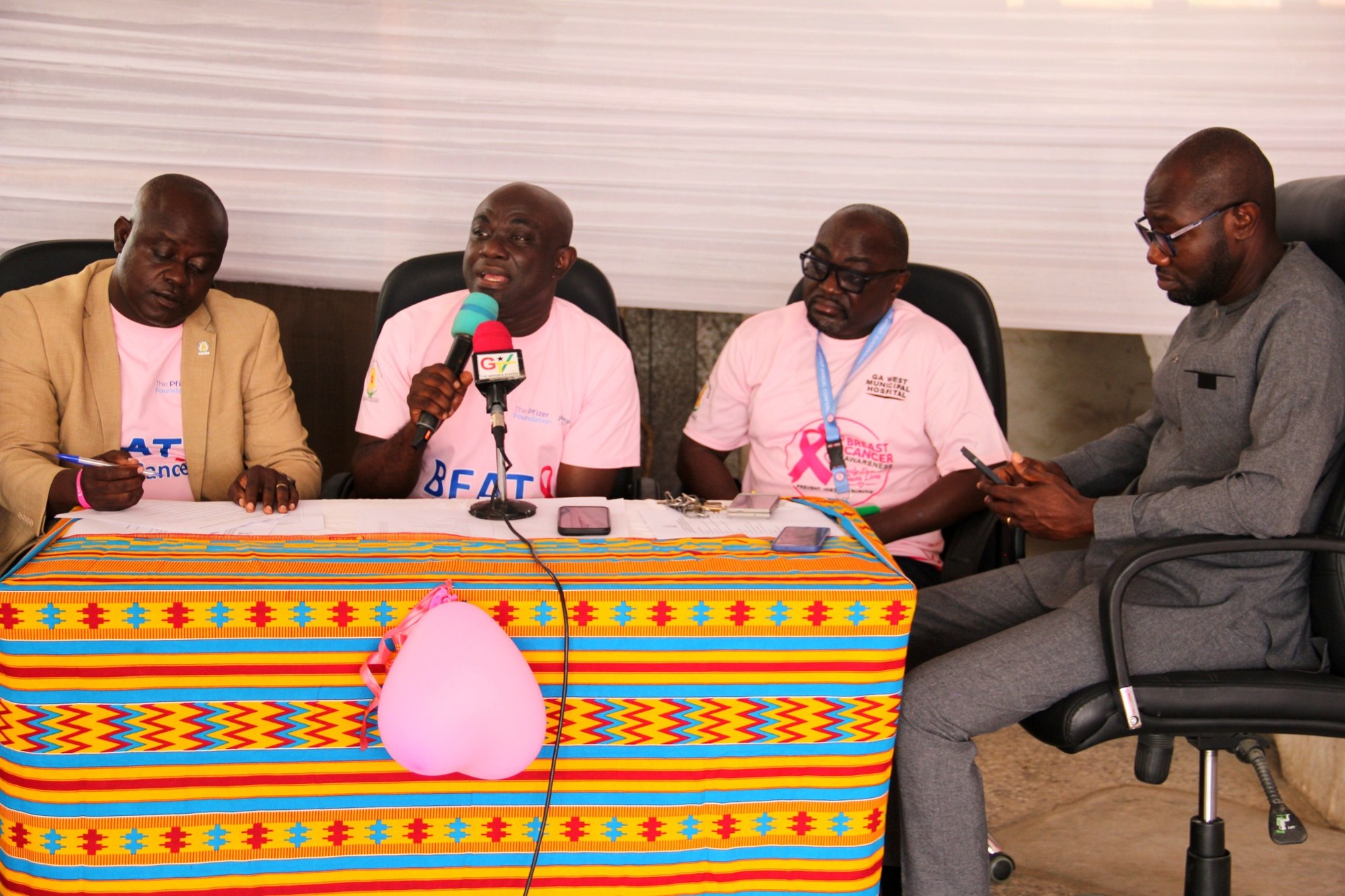 Dignitaries and speakers at the Breast Cancer Awareness Launch press table