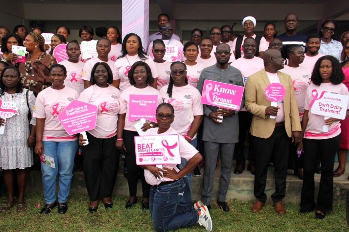 Group photograph of participants wearing breast cancer awareness shirts